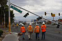 Crews continue to work around the clock to restore power and replace splintered power poles damaged by Tuesday's heavy winds. 

