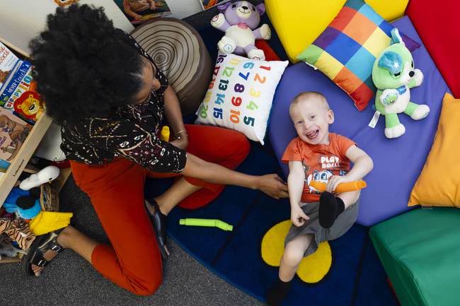 Wylde, 3, smiles as his teacher Kellie Cangas plays with him at the Nevada Blind Children’s Foundation, Thursday, July 10, 2025.