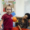 Photo: Chevelle, 3, attends a class with teacher Kellie C