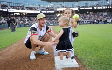 Vegas Golden Knights right wing Reilly Smith plays with daughters Navy, 1, and Isla, 3 on first base before the annual Battle For Vegas charity softball game between the Las Vegas Raiders and the Vegas Golden Knights at the Las Vegas Ballpark Saturday, July 12, 2025. This year’s Battle For Vegas takes place Saturday, June 27, 2026, at Las Vegas Ballpark with Smith returning as host and Team Vegas captain, squaring off against Las Vegas Raiders tight end Brock Bowers, who leads Team&nbsp;Raiders.
