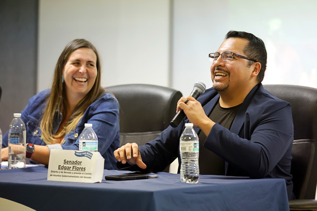 Assemblywoman Shea Backus and State Sen. Edgar Flores smile during a legislative town hall at the Make the Road Nevada office on Washington Avenue Wednesday, July 30, 2025. At the meeting, local elected leaders and community members reflected on the 2025 legislative session.