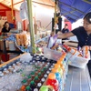 Aide Acevedo helps set up at Romero’s Produce during the reopening of the Broadacres Marketplace Friday, Aug. 1, 2025, in North Las Vegas. The market closed on June 21, due to fears tied to national immigration enforcement.