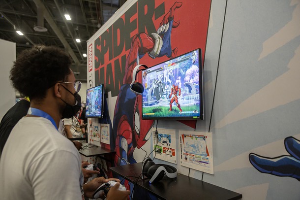 Video game fans play a demo of Marvel Token: Fighting Souls the Arc System Works booth during EVO 2025, the 3-day fighting game tournament that draws in the best players worldwide to Las Vegas Friday August 1, 2025.