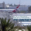 Photo: Air Canada and Frontier Airlines passenger jets ar