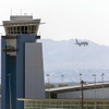 A view of the airport traffic control Tower at Harry Reid International Airport as an American Airlines passenger jet comes in for a landing Wednesday, Aug. 13, 2025.