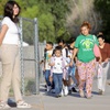 Photo: Parents walk with their children to Cortez Element