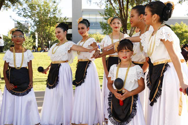 Members of the Latin Blendz Dance Academy representing Mexico prepare to march during the Latin Heritage Parade at Downtown Summerlin, Tuesday, Sept. 16, 2025.