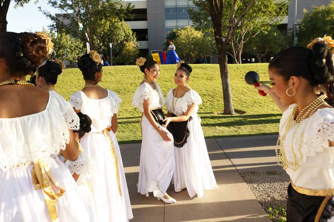 Members of the Latin Blendz Dance Academy representing Mexico prepare to march during the Latin Heritage Parade at Downtown Summerlin, Tuesday, Sept. 16, 2025.