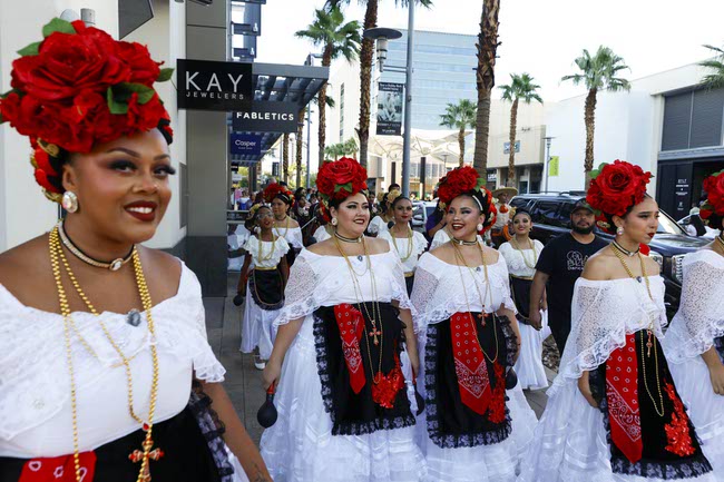 Members of the Latin Blendz Dance Academy representing Mexico prepare to march during the Latin Heritage Parade at Downtown Summerlin, Tuesday, Sept. 16, 2025.