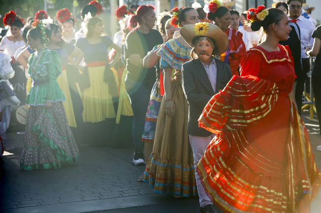 Performers prepare to march during the Latin Heritage Parade at Downtown Summerlin, Tuesday, Sept. 16, 2025.