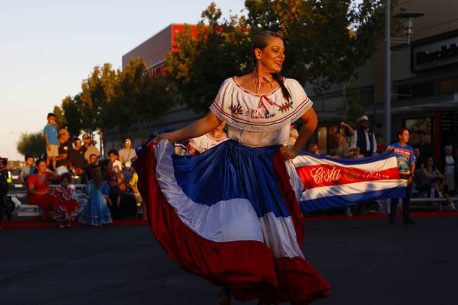 A performer representing Costa Rica dances during the Latin Heritage Parade at Downtown Summerlin, Tuesday, Sept. 16, 2025.