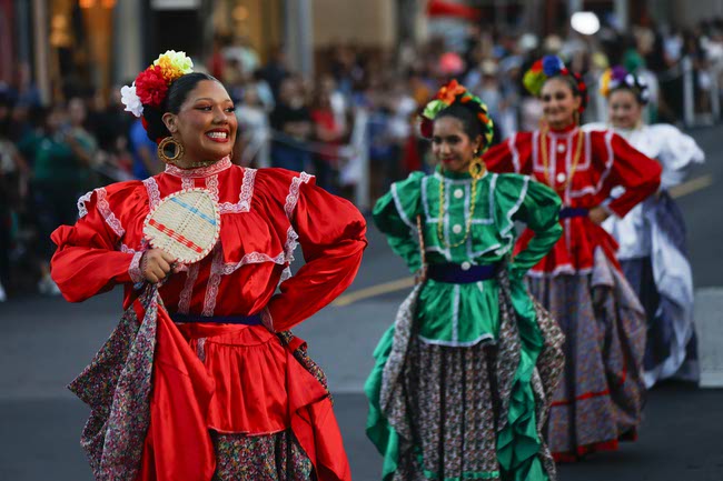 Performers march during the Latin Heritage Parade at Downtown Summerlin, Tuesday, Sept. 16, 2025.