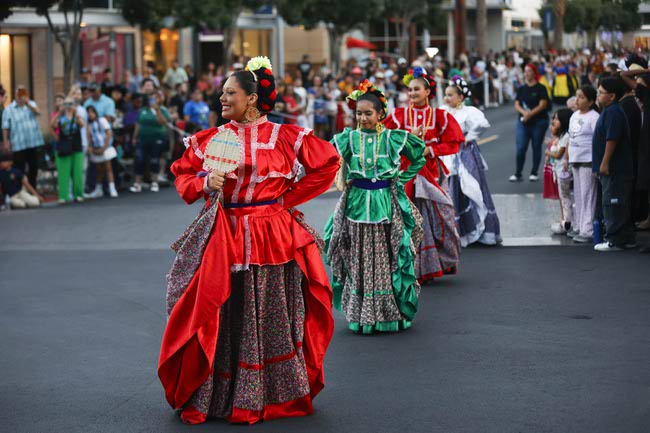 Performers march during the Latin Heritage Parade at Downtown Summerlin, Tuesday, Sept. 16, 2025.
