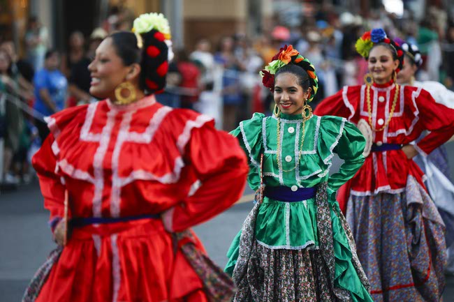 Performers march during the Latin Heritage Parade at Downtown Summerlin, Tuesday, Sept. 16, 2025.