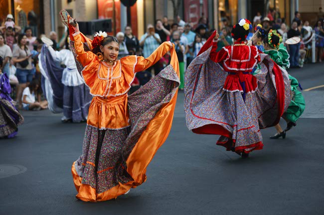 Performers march during the Latin Heritage Parade at Downtown Summerlin, Tuesday, Sept. 16, 2025.