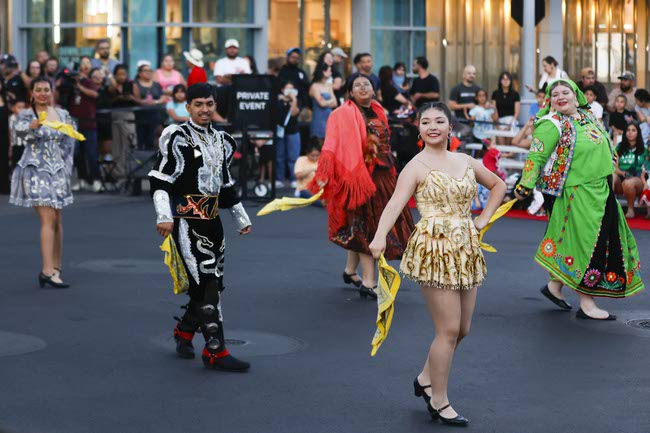 Performers representing Bolivia march during the Latin Heritage Parade at Downtown Summerlin, Tuesday, Sept. 16, 2025.