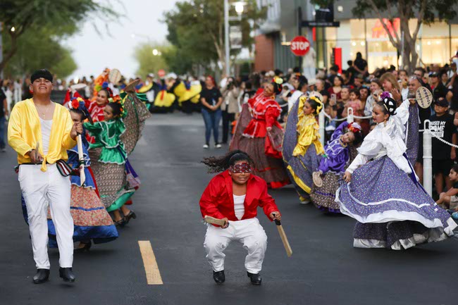 Performers march during the Latin Heritage Parade at Downtown Summerlin, Tuesday, Sept. 16, 2025.