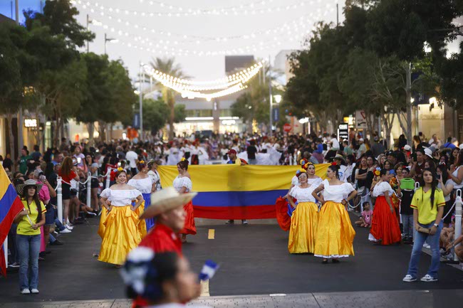 Performers march during the Latin Heritage Parade at Downtown Summerlin, Tuesday, Sept. 16, 2025.