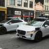 Waymo vehicles wait at an intersection in San Francisco, Wednesday, Oct. 22, 2025. The autonomous ride-hailing service is coming to Las Vegas in 2026.
