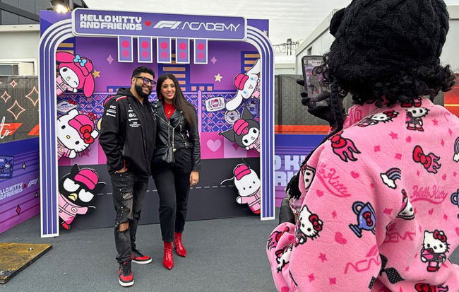 Race fans pose at the Hello Kitty F1 Pit Stop Cafe during the 2025 F1 Las Vegas Grand Prix Friday, Nov. 21, 2025.