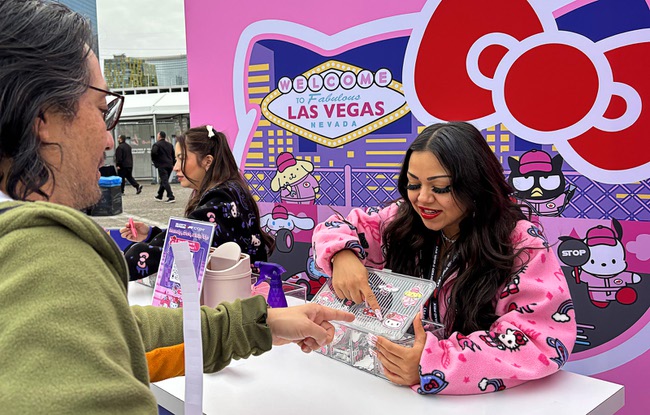 A race fan picks out a temporary tattoo at the Hello Kitty F1 Pit Stop Cafe during the 2025 F1 Las Vegas Grand Prix Friday, Nov. 21, 2025.