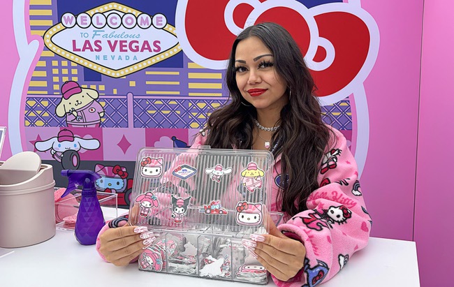 A woman displays temporary tattoos at the Hello Kitty F1 Pit Stop Cafe during the 2025 F1 Las Vegas Grand Prix Friday, Nov. 21, 2025.