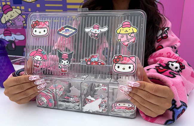 A woman displays temporary tattoos at the Hello Kitty F1 Pit Stop Cafe during the 2025 F1 Las Vegas Grand Prix Friday, Nov. 21, 2025.