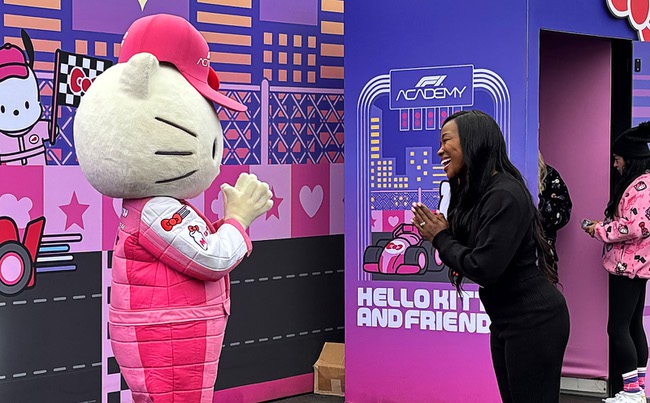 Hello Kitty greets a race fan at the Hello Kitty F1 Pit Stop Cafe during the 2025 F1 Las Vegas Grand Prix Friday, Nov. 21, 2025.