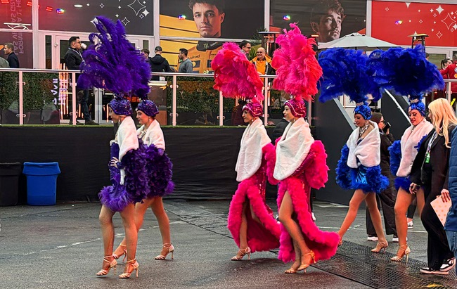 Showgirls walk through the Grand Prix Plaza during the 2025 F1 Las Vegas Grand Prix Friday, Nov. 21, 2025.