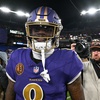 Photo: Baltimore Ravens quarterback Lamar Jackson looks o