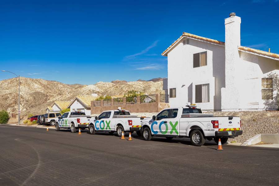 Cox Communications work vehicles are photographed in a residential neighborhood in Laughlin.