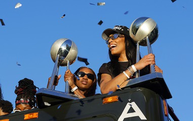 Las Vegas Aces guard Jackie Young and center A’ja Wilson hold up trophies during a championship parade Friday, Oct. 17, 2025. The Aces defeated the Phoenix Mercury on Friday, Oct. 10 to sweep the 2025 WNBA Finals in four games. STEVE&nbsp;MARCUS
