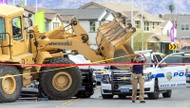Two Henderson police officers shot a suspect who drove a stolen front loader construction vehicle at an officer and rammed two patrol cars Sunday morning ...