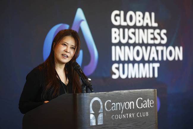 Natalie Kim, a representative of Serious Golfer Labs, speaks about the Korea based company’s G.Grip golf clubs that analyze player swing patterns during the Global Business Innovation Summit in Summerlin, Monday, Jan. 5, 2026.