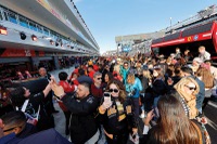Fans gather Nov. 20, 2025, in the pit area before practice runs at  Las Vegas Grand Prix. This pit area was one of the marquee access points often featured in social media posts during race weekend. 