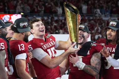 Indiana quarterback Fernando Mendoza holds the trophy after their win against Miami in the College Football Playoff national championship game, Monday, Jan. 19, 2026, in Miami Gardens,&nbsp;Fla. 
