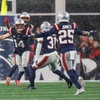 New England Patriots linebacker Robert Spillane (14) celebrates with safety Craig Woodson (31) and cornerback Marcus Jones (25) after breaking up a pass in the final seconds of the second half of an NFL divisional playoff football game against the Houston Texans, Sunday, Jan. 18, 2026, in Foxborough, Mass.
