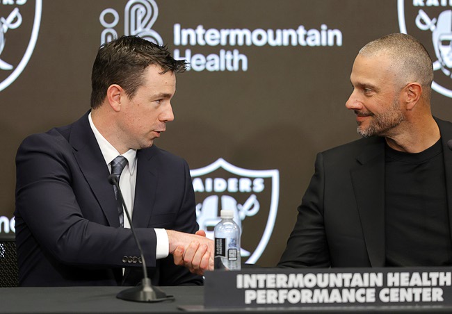 Las Vegas Raiders new head coach Klint Kubiak, left, shakes hands with Raiders general manager John Spytek during a news conference at Raiders Headquarters in Henderson Tuesday, Feb. 10, 2026. Kubiak was previously the offensive coordinator for the Seattle Seahawks. 