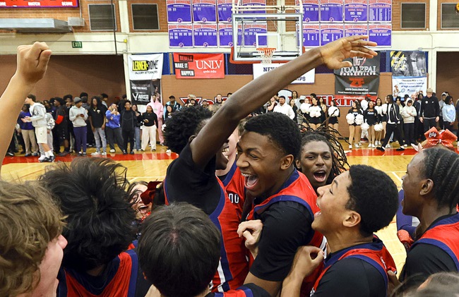 Coronado Players celebrate after beating Liberty in the boy’s 5A state championship basketball game at Valley High School Friday, Feb. 20, 2026. Coronado defeated Liberty 60-55.