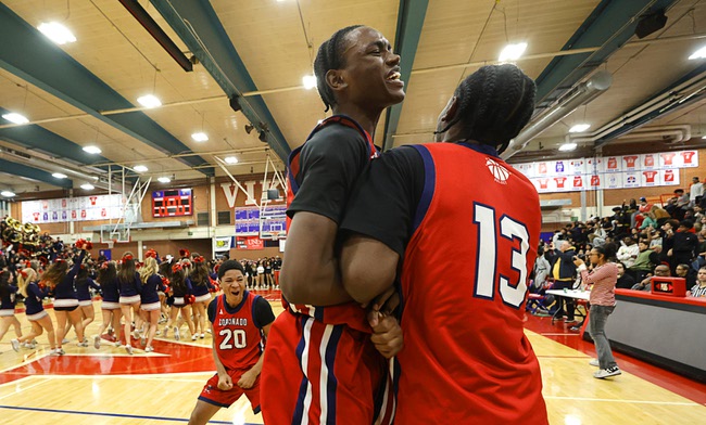 Coronado’s Demari Hunter (3) and Eric Hopkins (13) celebrate after Coronado beat Liberty in the boy’s 5A state championship basketball game at Valley High School Friday, Feb. 20, 2026. Coronado defeated Liberty 60-55.