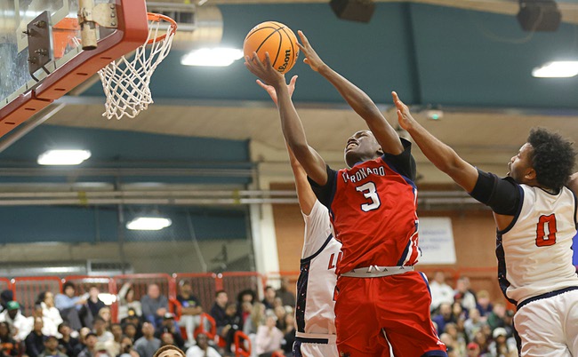 Coronado’s Demari Hunter (3) goes to the basket between Liberty’s Taytum Cios-Webb (20) and Tyus Thomas (0) during the boy’s 5A state championship basketball game at Valley High School Friday, Feb. 20, 2026. Coronado defeated Liberty 60-55.