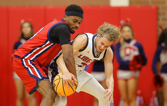 Coronado’s Jonny Collins (0) steals the ball from Liberty’s (3) during the boy’s 5A state championship basketball game at Valley High School Friday, Feb. 20, 2026. Coronado defeated Liberty 60-55.