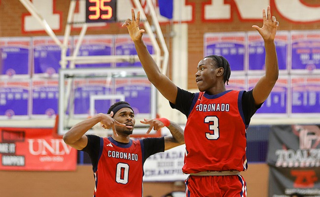 Coronado’s Jonny Collins (0) celebrates with Demari Hunter (3) after Hunter’s three-point basket against Liberty during the boy’s 5A state championship basketball game at Valley High School Friday, Feb. 20, 2026. Coronado defeated Liberty 60-55.