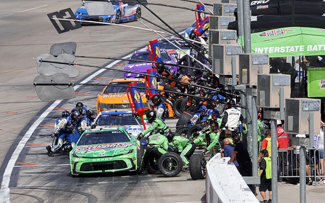 Driver Christopher Bell, foreground, and other drivers make pit stops during a NASCAR Cup Series auto race at the Las Vegas Motor Speedway Sunday, March 15, 2026, in Las Vegas.