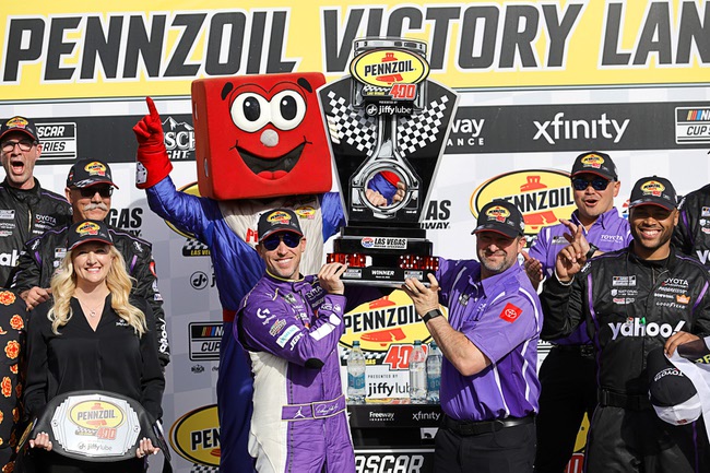 Denny Hamlin, left, holds up the trophy with a teammate after winning a NASCAR Cup Series auto race at Las Vegas Motor Speedway Sunday, March 15, 2026, in Las Vegas.