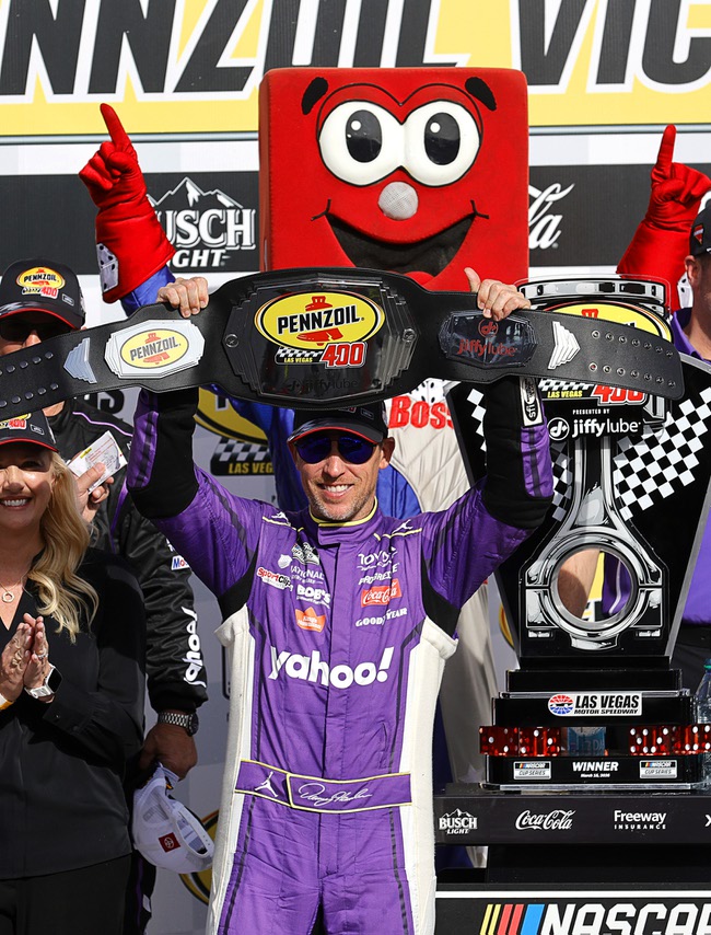 Denny Hamlin (11) poses in Victory Lane after winning a NASCAR Cup Series auto race at Las Vegas Motor Speedway Sunday, March 15, 2026, in Las Vegas.