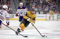 Vegas Golden Knights right wing Cole Smith (22) skates against Edmonton Oilers defenseman Connor Murphy (5) during the first period of an NHL hockey game ...