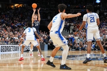 UConn guard Braylon Mullins (24) scores the winning basket during the second half against Duke in the Elite Eight of the NCAA college basketball tournament, ...