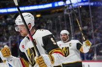 Vegas Golden Knights center Jack Eichel, front, reacts after scoring the winning goal as right wing Mark Stone celebrates in overtime of an NHL hockey ...