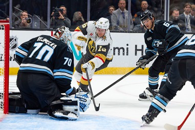 Vegas Golden Knights right wing Pavel Dorofeyev (16) passes the puck against Utah Mammoth goaltender Karel Vejmelka (70) and John Marino (6) during the second period of Game 3 of the first round in an NHL hockey Stanley Cup playoff series, Friday, April 24, 2026, in Salt Lake&nbsp;City.